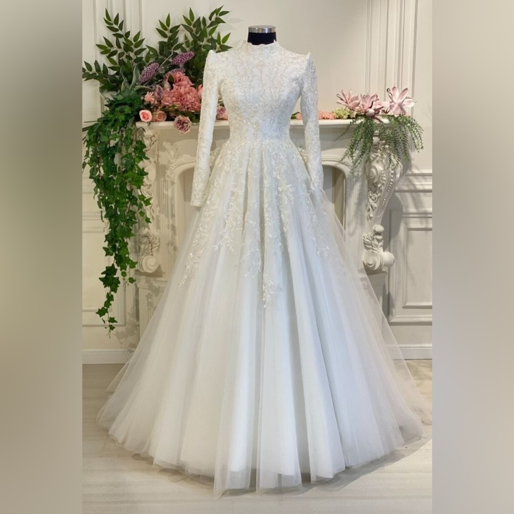Beautiful bridal full sleeves high neck ballgown.
Purchase for $1,500